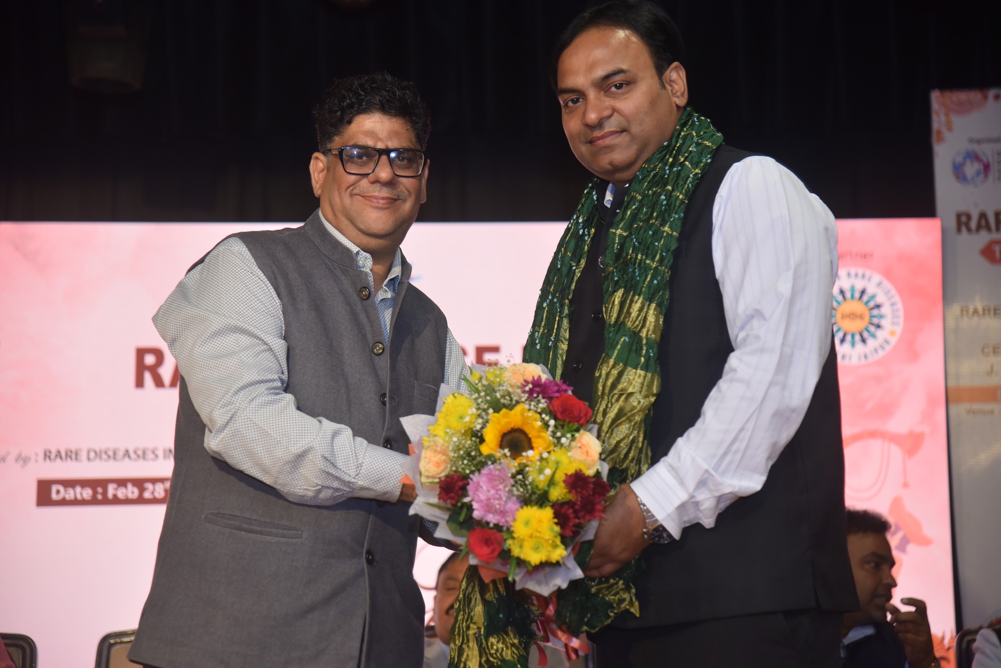 A medical professional delivering a presentation at the Jaipur conference.